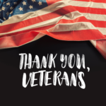 a partial American flag in the breeze on the top half with "thank you, veterans" on the bottom against a black background
